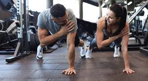 Image of man and woman doing Cardio Wolverhampton to tone their arms. 